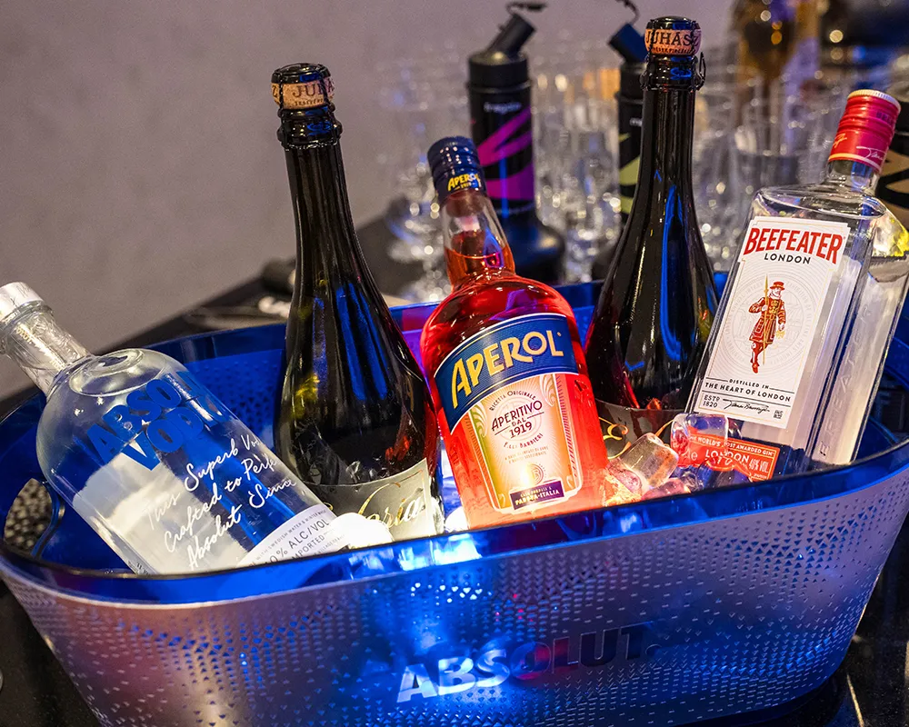 Ice bucket with sparkling wine and spirits at an event